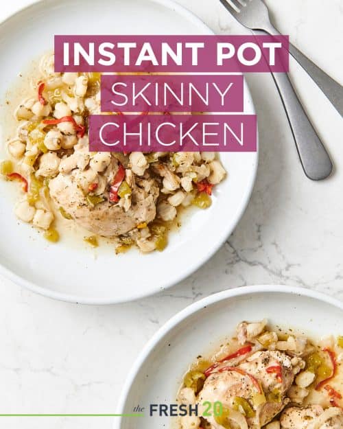 Two plates of Instant Pot skinny chicken on a white marble surface with fork and knife from above