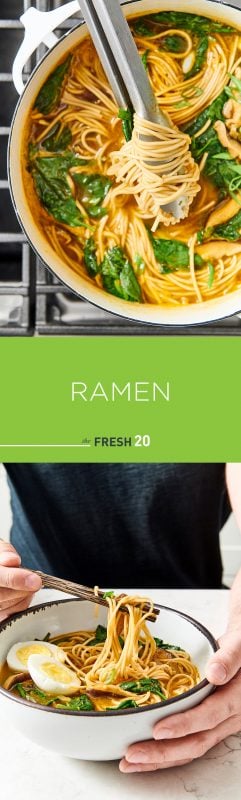 Man using chopsticks in a ceramic bowl of suculent ramen noodles with a stockpot full of noodles, spinach and onions on a cooktop