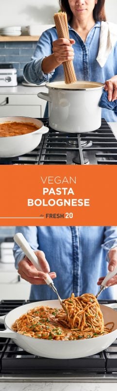 Woman placing uncooked pasta noodles into a pot next to vegan pasta bolognese sauce on a cooktop