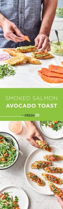 Man preparing smoked salmon avocado toast in a white marble kitchen & hands grabbing toasts with arugula & tomato salads in bowls