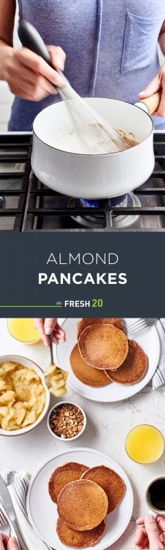 Woman whisking pancake batter in white pot on cooktop & 2 stacks of fluffy pancakes with apple compote on white marble surface