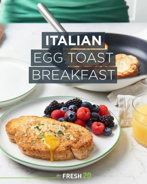 Woman serving easy Italian egg toasts with mixed berries in a white marble kitchen