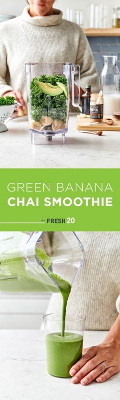 Woman making a blender full of kale, avocados, bananas & chai spices pouring into a glass in a white marble kitchen