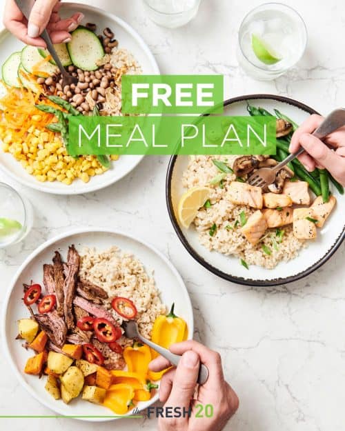 Three healthy protein, vegetable & rice bowls on a marble surface