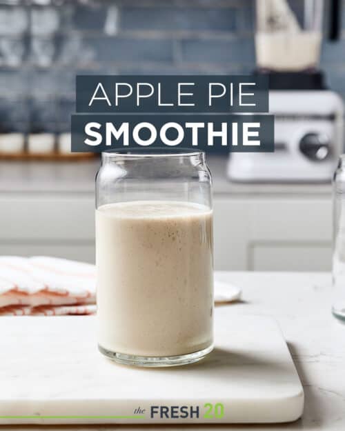 Glass of easy healthy apple pie sugar-free smoothie treat on a white marble surface in a beautiful modern kitchen