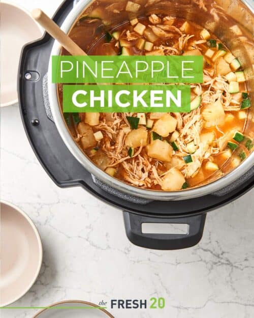 Hearty pineapple chicken Instant Pot Crock-Pot soup full of vegetables with a wooden spoon