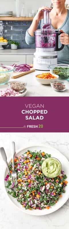 Woman chopping red cabbage in food procesor surrounded with bowls of fresh cut vegetables with a ceramic bowl of vegan chopped salad & a cup of avocado dressing